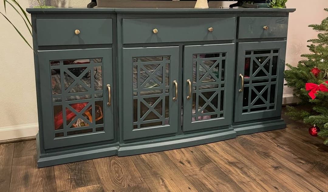 Custom cabinet installation with decorative panel doors and finished wood flooring